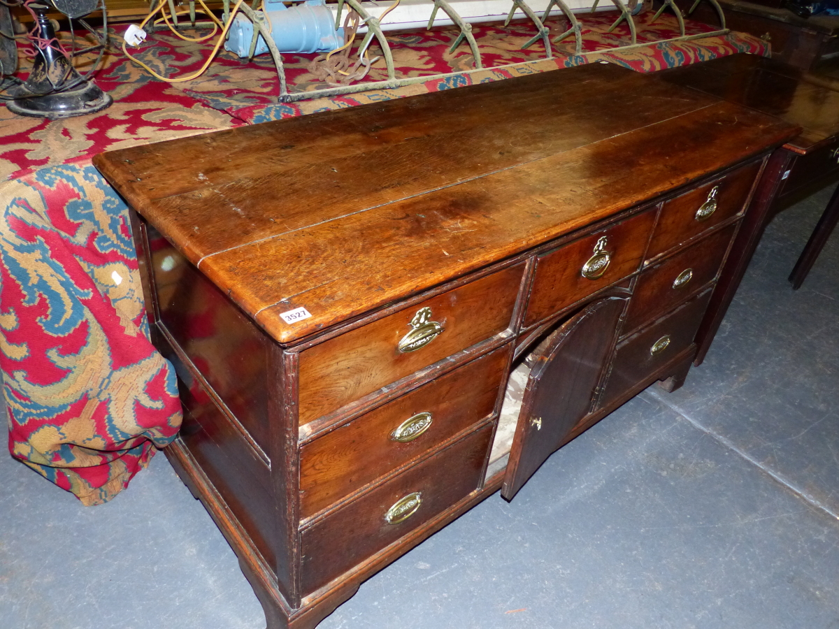 AN 18th C. OAK DRESSER BASE, A CENTRAL DRAWER AND ROUND ARCHED TOPPED CUPBOARD DOOR BELOW THE - Image 2 of 7