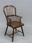 AN ANTIQUE WINDSOR CHAIR WITH FIVE STICK BACK, SADDLE SEAT AND RING TURNED LEGS.