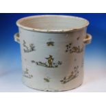 AN ANTIQUE FRENCH FAIENCE TWO HANDLED CYLINDRICAL CACHE POT, POSSIBLY STRASBOURG, PAINTED IN