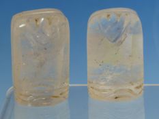 A PAIR OF ARABIC ROCK CRYSTAL CHESS PIECES WITH HEART SHAPED TOPS TO THE COLUMNAR SHAPES. H 5cms.