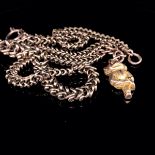 A VICTORIAN 9ct OLD GOLD UNHALLMARKED, FANCY LINK GRADUATED ALBERT CHAIN WITH A HANGING CHIMPANZEE