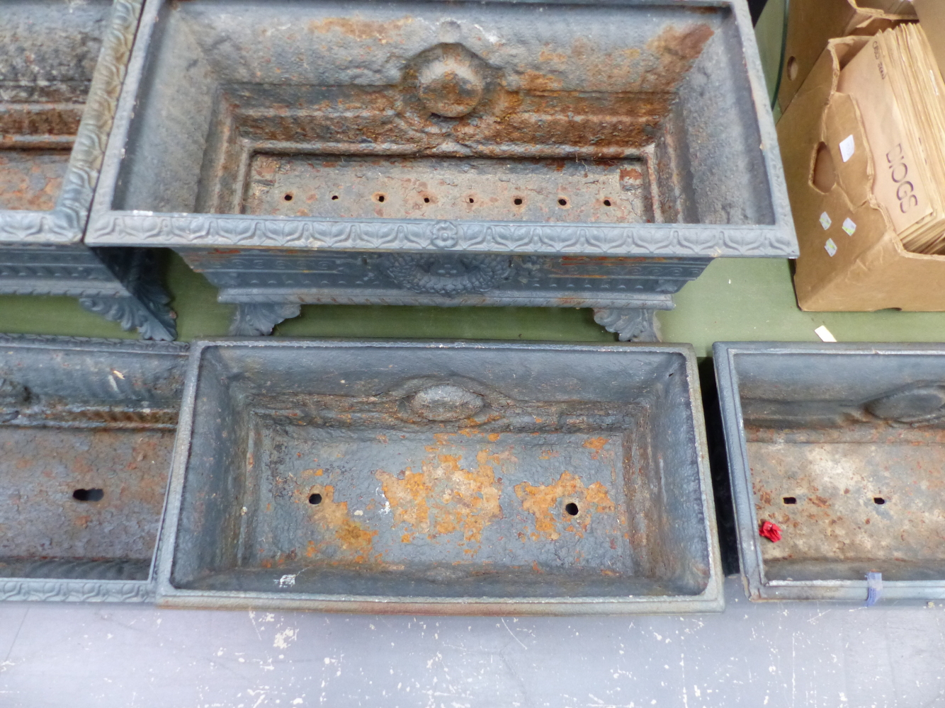 A HARLEQUIN SET OF SIX ANTIQUE IRON PLANTERS, THE RECTANGULAR RIMS OVER FLUTED BANDS AND CENTRAL - Image 8 of 11