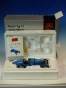 A CMC 1:18 SCALE MODEL BUGATTI TYPE 35 GRAND PRIX 1924 NUMBER M-063 WITH PAPERWORK AND ORIGINAL BOX,