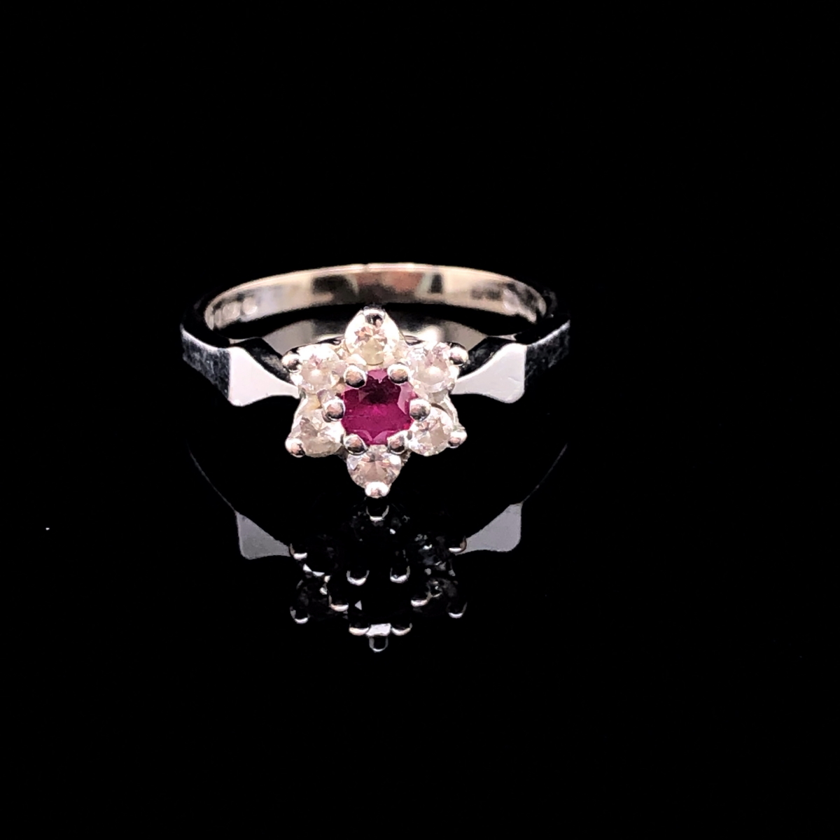 AN 18ct WHITE GOLD RUBY AND DIAMOND CLUSTER RING. THE RUBY A ROUND CUT IN A SIX CLAW SETTING - Image 3 of 3