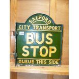 AN ALUMINIUM SALFORD CITY TRANSPORT BUS STOP SIGN.