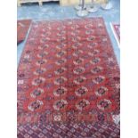 AN ANTIQUE TEKKE BOKHARA MAIN CARPET. 280 x 200cms.