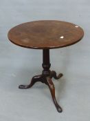 AN ANTIQUE CIRCULAR TILT TOP TABLE ON GUN BARREL COLUMN AND TRIPOD WITH LONG NOSE CLUB FEET. Dia.