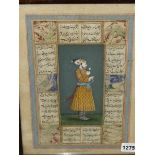 AN INDO PERSIAN PAINTING OF A STANDING PRINCELY FIGURE WEARING A SWORD AND HOLDING A FLOWER,