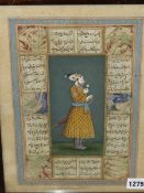 AN INDO PERSIAN PAINTING OF A STANDING PRINCELY FIGURE WEARING A SWORD AND HOLDING A FLOWER,