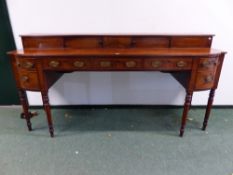 A REGENCY MAHOGANY SIDEBOARD, THE RECESSED GALLERY BACK WITH TWO LINE INLAID SLIDING DOORS, THE