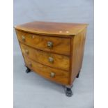A SMALL REGENCY MAHOGANY BOW FRONT CHEST OF THREE LONG GRADUATED DRAWERS, WITH LION MASK BRASS