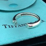 A TIFFANY AND CO PALOMA PICASSO SILVER TENDERNESS HEART RING. APPROX SIZE S. COMPLETE WITH INNER