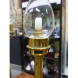 TWO BRASS CANDLESTICKS, SPRING LOADED TO TAKE WAX CANDLES AND WITH DETACHABLE STORM SHADES, THE