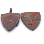 A MEDIAEVAL BRONZE SHIELD SHAPED PENDANT AND A MOUNT, BOTH WITH ARMORIALS WITH RED ENAMELLING, THE