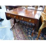 A REGENCY MAHOGANY SOFA TABLE, THE ROUNDED RECTANGULAR FLAP TOP OVER TWO DRAWERS, THE RECTANGULAR