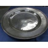 AN 18th C. PEWTER CHARGER, THE RIM BEARING THE PEWTERERS TOUCH MARK G S. Dia. 51cms.