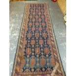 AN ANTIQUE CAUCASIAN KUBA RUNNER. 344 x 116cms.