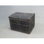 A LEATHER COVERED TEAK TRUNK, THE CLOSE NAILED METAL STRAPS ON THE HINGED LID, IRON HANDLES.