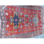 AN ANTIQUE CAUCASIAN KAZAK RUG. 215 x 159cms.