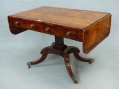 A REGENCY MAHOGANY SOFA TABLE, THE ROSEWOOD CROSS BANDED TOP ABOVE TWO DRAWERS, A SQUARE