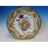 A NANTGARW PLATE PAINTED WITH A BUNCH OF FLOWERS CENTRAL TO SWAGS OF PINK ROSES INSIDE SCROLLS OF