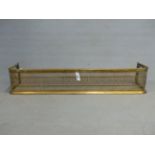 A BRASS MESH FIRE KERB WITH BRASS BAR TOP AND STEPPED FOOT. W 124 x D 33 x H 24cms.