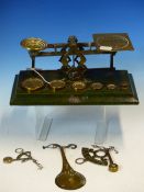 FOUR LETTER SCALES, THE LARGEST BY SAMSON MORDAN WITH SIX BRASS WEIGHTS RESTING ON THE GREEN LEATHER