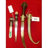 A JAMBIYA WITH WOODEN HANDLE AND NICKEL SCABBARD. 46cms. TOGETHER WITH A LEATHER HANDLED DAGGER WITH