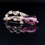 AN ANTIQUE PINCHBECK, DIAMOND AND CABOCHON TEARDROP AMETHYST FOLIATE STYLE BROOCH. LENGTH 3.9cms,