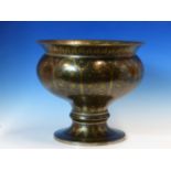 A BENARES BRASS STANDING BOWL WORKED WITH VINES, FLOWERS AND LEAVES, THE BRASS DETAILED IN SILVER ON