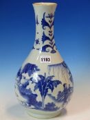 A CHINESE BLUE AND WHITE BOTTLE VASE, THE WAISTED NECK WITH FLOWER STEMS ALTERNATING WITH PRECIOUS