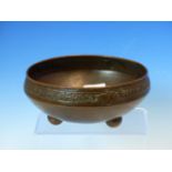 AN ARTS AND CRAFTS COPPER BOWL STAMPED H R F AND WITH MONOGRAM, THE RIM INSCRIBED TO AND