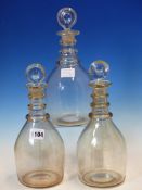 THREE SIMILAR TRIPLE RING NECKED GLASS DECANTERS AND STOPPERS TOGETHER WITH THREE OTHERS LATER