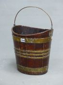 AN EARLY 19th.C. MAHOGANY OVAL PEAT BUCKET WITH BRASS HANDLE AND COOPERED SIDES. W 33.5 x H 35cms