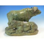 RICHARD MAISTRI, A GREENSTONE CARVING OF A WILDEBEESTE FAMILY, THE MOTHER AND CALF RECLINING TO