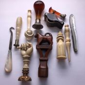 A COLLECTION OF FIVE VARIOUS SEALS, TWO MAGNIFYING GLASSES, TWO BONE SEWING ITEMS, A MOTHER OF PEARL