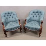 A PAIR OF VICTORIAN CARVED MAHOGANY ARMCHAIRS UPHOLSTERED IN DEEP TURQUOISE DAMASK. SCROLLS BELOW TH