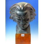 AFTER FAGLIN, A BRONZED PLASTER HEAD OF BEETHOVEN LOOKING DOWNWARDS IN CONCENTRATION. H 47cms.