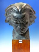 AFTER FAGLIN, A BRONZED PLASTER HEAD OF BEETHOVEN LOOKING DOWNWARDS IN CONCENTRATION. H 47cms.