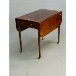 A REGENCY ROSEWOOD AND CROSS BANDED PEMBROKE TABLE WITH END DRAWER, ON RING TURNED LEGS WITH BRASS