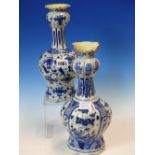 TWO 18th C. DUTCH DELFT BLUE AND WHITE ONION TOPPED VASES VARIOUSLY PAINTED WITH FLOWERS AND