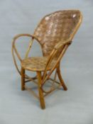 A WOVEN SPLIT WALNUT AND RUSTIC BENTWOOD ELBOW CHAIR, THE HOOP BACK AND CIRCULAR SEAT OF WOVEN