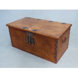 AN ANTIQUE COLONIAL HARDWOOD BLANKET CHEST WITH ELABORATE IRON LOCK HASP AND IRON STUDDED BOX DECOR