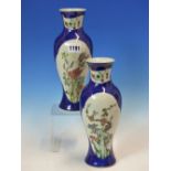 A PAIR OF CHINESE BALUSTER VASES PAINTED IN FAMILLE VERTE ENAMELS WITH RESERVES OF BUTTERFLIES AND