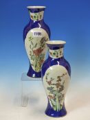 A PAIR OF CHINESE BALUSTER VASES PAINTED IN FAMILLE VERTE ENAMELS WITH RESERVES OF BUTTERFLIES AND