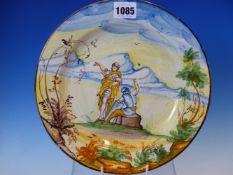 A MAIOLICA PLATE PAINTED WITH A YELLOW ROBED FIGURE STANDING BY A SEATED SOLDIER IN A LANDSCAPE WITH