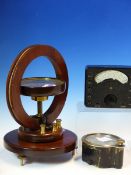 A MAHOGANY MOUNTED MAGNOMETER COMPASS, A UNIVERSAL AVOMINOR RESISTANCE METER IN LEATHER CASE AND A