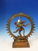 A HINDU COPPER RICH FIGURE OF THE LORD OF THE DANCE NATARAJA BACKED BY A CIRCULAR FLAME MANDALA