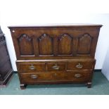 AN 18th C. OAK MULE CHEST, THE LID OVER FOUR ARCHED PANELS, THE BASE WITH THREE