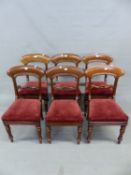 A SET OF SIX VICTORIAN MAHOGANY CHAIRS, ECH WITH BROAD ARCHED TOP RAILS OVER FOLIATE BAR BACKS,